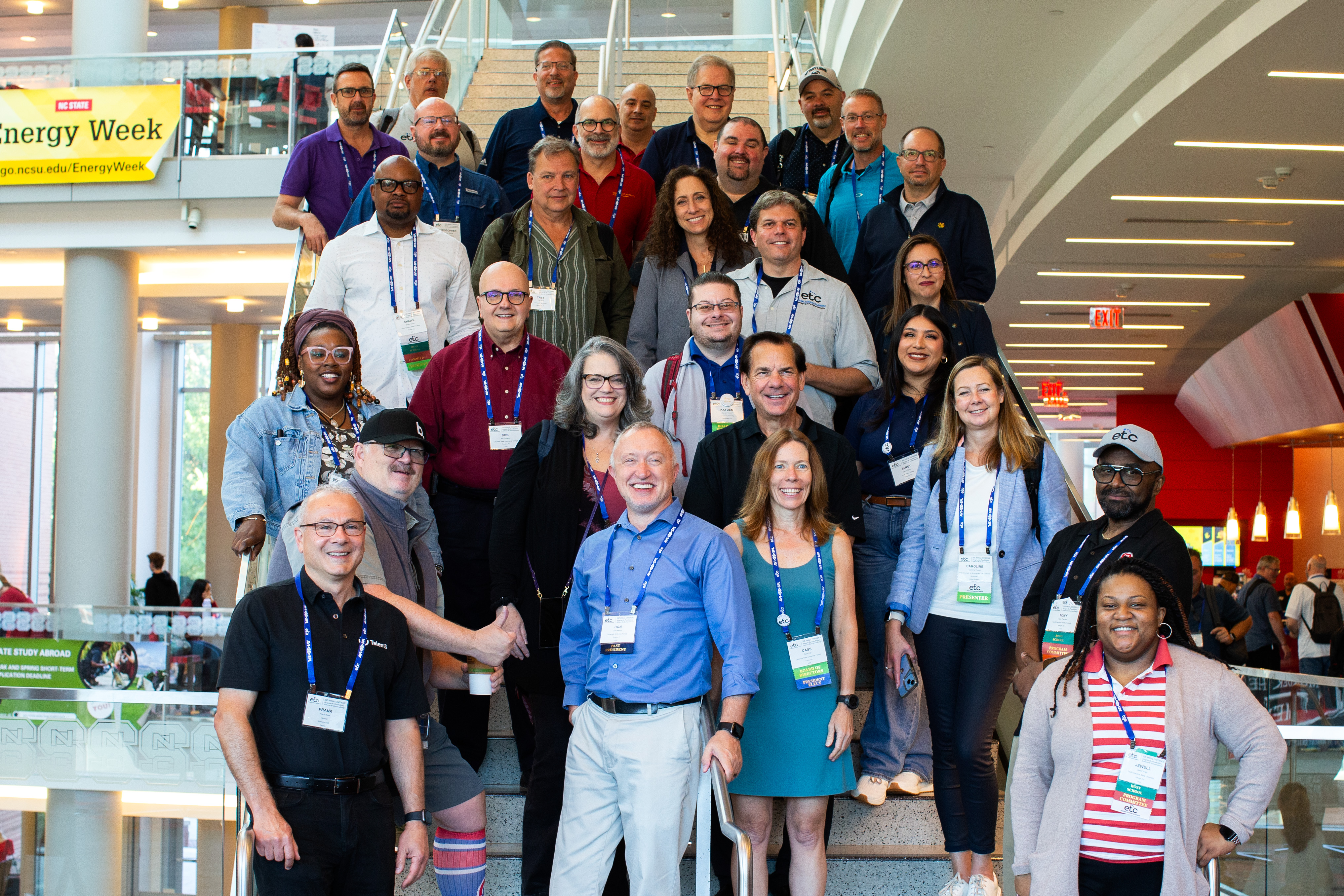 group of people smiling at conference